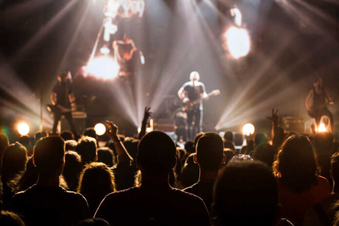 Crowd,At,Concert,-,Cheering,Crowd,In,Bright,Colorful,Stage