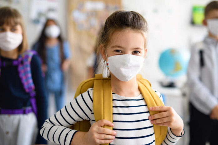 Child,With,Face,Mask,Going,Back,To,School,After,Covid-19