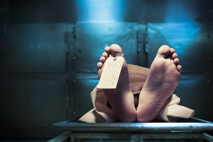 Grungy,Photo,Of,Feet,With,Toe,Tag,On,A,Morgue