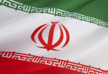 Iranian flag with green, white, red stripes.