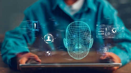 Person holding tablet displaying digital face graphics