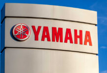 Yamaha logo displayed on a sign against a blue sky