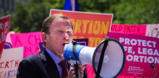 A speaker using a megaphone at an abortion rights protest