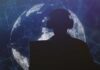 Anxiety Grows Over Canada’s Expanding Surveillance Powers! Silhouette of a person wearing headphones in front of a digital globe