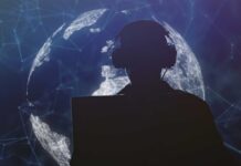 Silhouette of a person wearing headphones in front of a digital globe