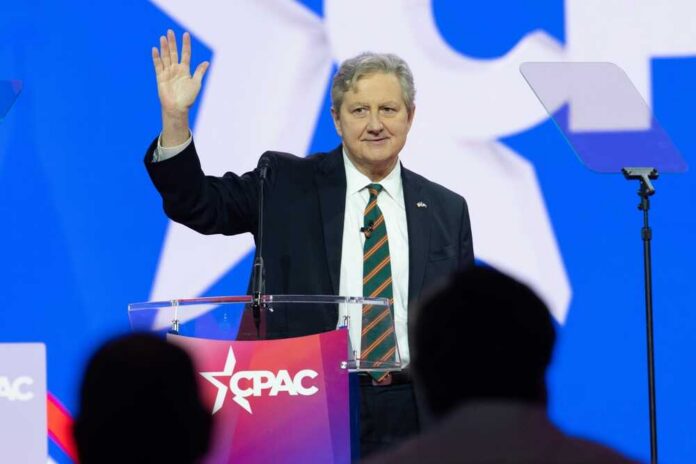 shutterstock_2269916559.jpg A speaker waving at an audience during a conference