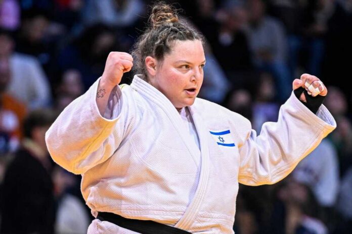 Female judo athlete celebrating a victory