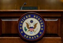 War Powers Showdown: Senator Takes a Stand United States Senate emblem on wooden podium