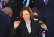 Woman smiling in formal attire at an event