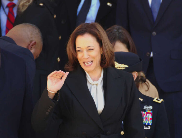 Kamala Harris greets people_2492121505.jpg Woman smiling in formal attire at an event