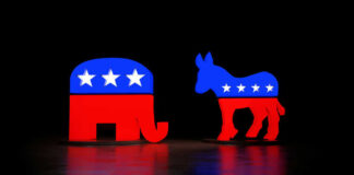 Red and blue elephant and donkey symbols dark background