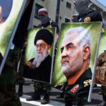 Fraudulent Asylum Claim EXPOSED – Soleimani Family Under Fire Demonstrators holding large portraits of military and political figures during a protest
