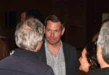 Group of people engaged in conversation at a social event