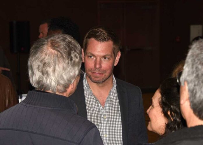 Group of people engaged in conversation at a social event