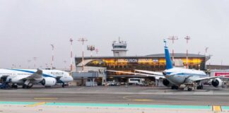 Airplanes parked at Ben Gurion Airport with terminal in the background