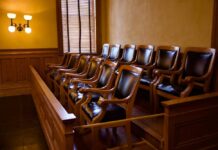 Empty jury box with wooden chairs in a courtroom