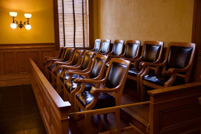 Empty jury box with wooden chairs in a courtroom