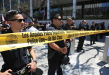 Massive LAPD Data Breach — 337,000 Files Exposed Los Angeles police officers standing behind a police line