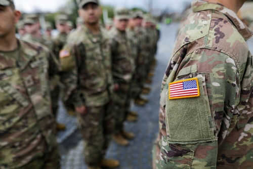 Military personnel standing in formation outdoors