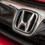 Close-up of a Honda car logo.