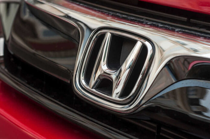 Close-up of a Honda car logo.