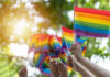 Colorado’s Stealth Move CRUSHES Parental Rights Hands waving rainbow pride flags outdoors