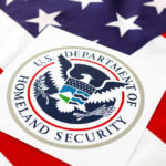 New HUD-DHS Partnership Ends Housing for Illegals Department of Homeland Security seal on American flag