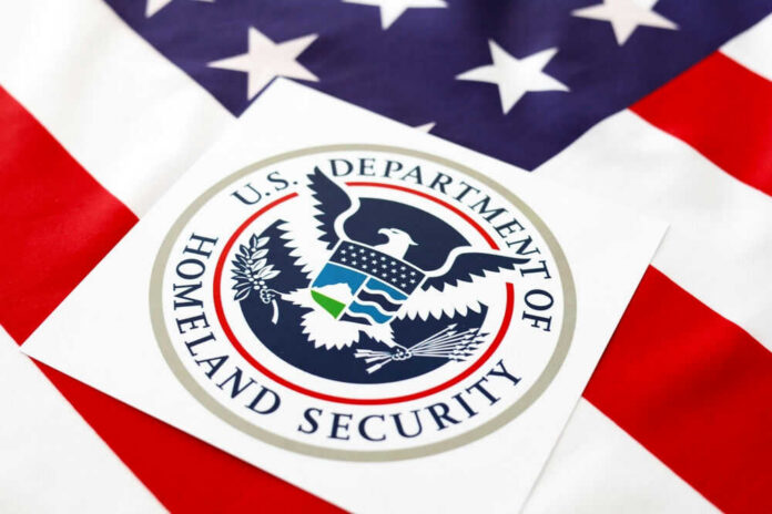 dhsid2053481309jpg Department of Homeland Security seal on American flag