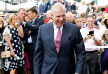 No Vetting for Andrew: UK’s Risky Royal Move smiling man in a suit walking through a crowd