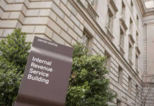 IRS building sign outside government building with greenery