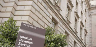 IRS building sign outside government building with greenery