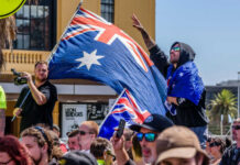 Crowd with Australian flags at an outdoor rally