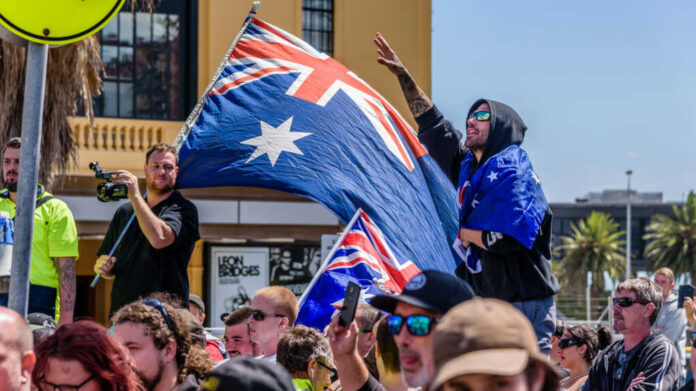 Crowd with Australian flags at an outdoor rally