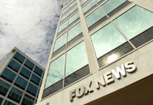 Exterior view of a modern office building with the sign 'FOX NEWS'