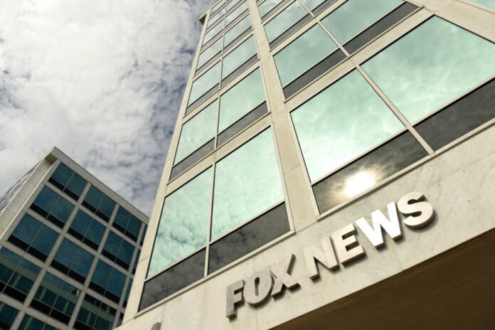 Exterior view of a modern office building with the sign 'FOX NEWS'