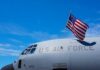 Massive Reward for ACCUSED US Traitor Monica Witt! Close-up of a military aircraft with an American flag