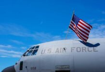 Massive Reward for ACCUSED US Traitor Monica Witt! Close-up of a military aircraft with an American flag