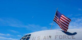 Close-up of a military aircraft with an American flag