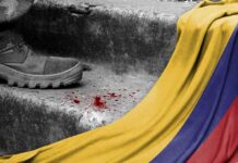 Illegal Militias Crush Voter Freedom in Colombia A military boot on concrete steps with blood stains and a Colombian flag draped nearby