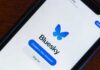 Kremlin’s Bluesky Takeover – Could This Undermine the US Election? Mobile phone displaying the Bluesky app login screen