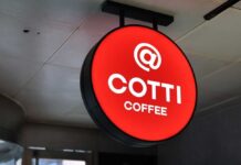 California Coffee Shake-Up — Chinese Giant’s Bold Move Starbucks round mermaid logo sign on a brick building