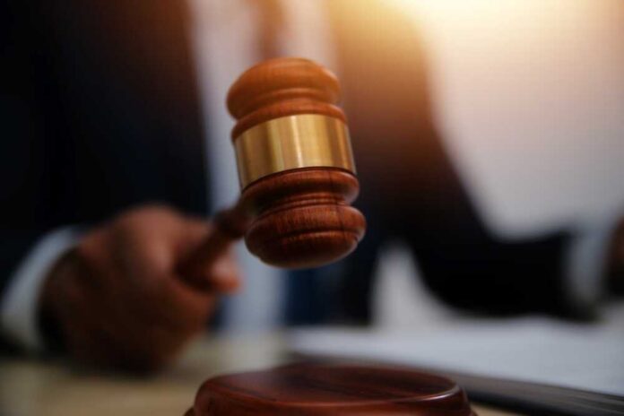 Law,Theme,,Gavel,Or,Mallet,Of,The,Judge,,Lawyer,Enforcement A gavel being struck on a desk in a courtroom setting