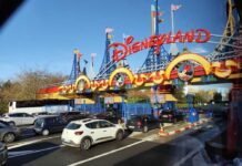Massive Disney Lawsuit — Face Scans Gone TOO FAR? Entrance to Disneyland with cars waiting in line