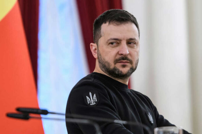 volodymyr-zelenskiy2436404823jpg man in black sweatshirt at a podium looking to the side