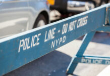 Blue NYPD barricade with Police Line - Do Not Cross.