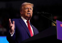 Trump Defends Military Authority Amid Maryland Governor Clash Man speaking at a podium with microphone