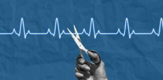 Hand holding scissors near heartbeat line illustration