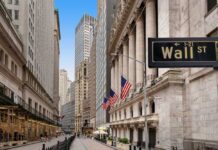 Wall Street’s “Non‑Cash” Trick Bleeds Portfolios View of Wall Street with skyscrapers and American flags