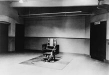 Shocking Reversal Hits Alabama Executions Interior view of a courtroom with wooden benches and large murals