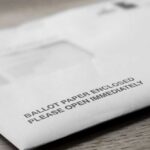 Ballot envelope on a wooden surface